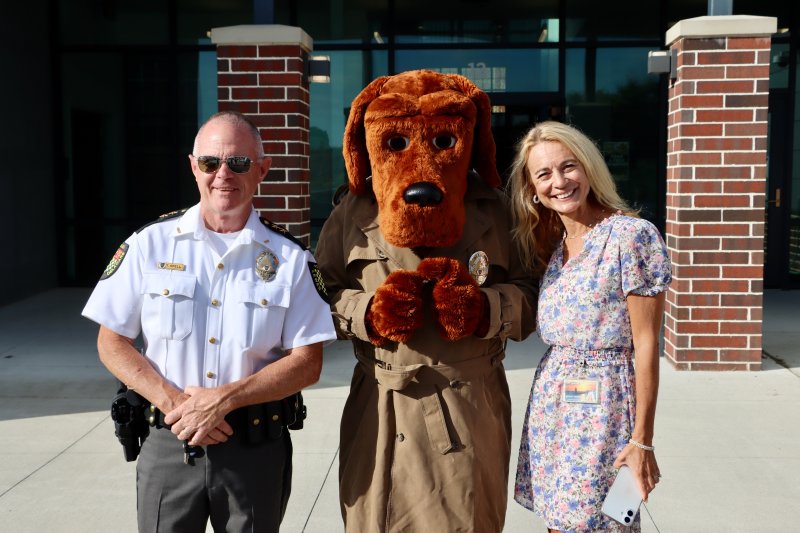 Lewes Police Chief Tom Spell, left, with McGruff the Crime Dog and Jenny Nauman, Cape Henlopen School District superintendent, outside Lewes Elementary School Sept. 3. BILL SHULL PHOTO